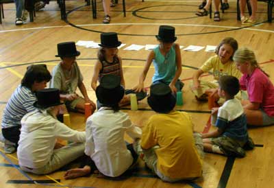 Circle of kids with tophats