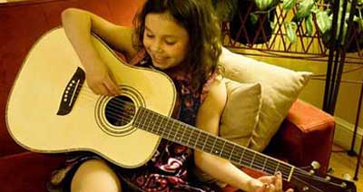 kid playing guitar